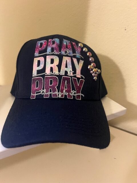 Navy blue hat with prayer logo and jewels